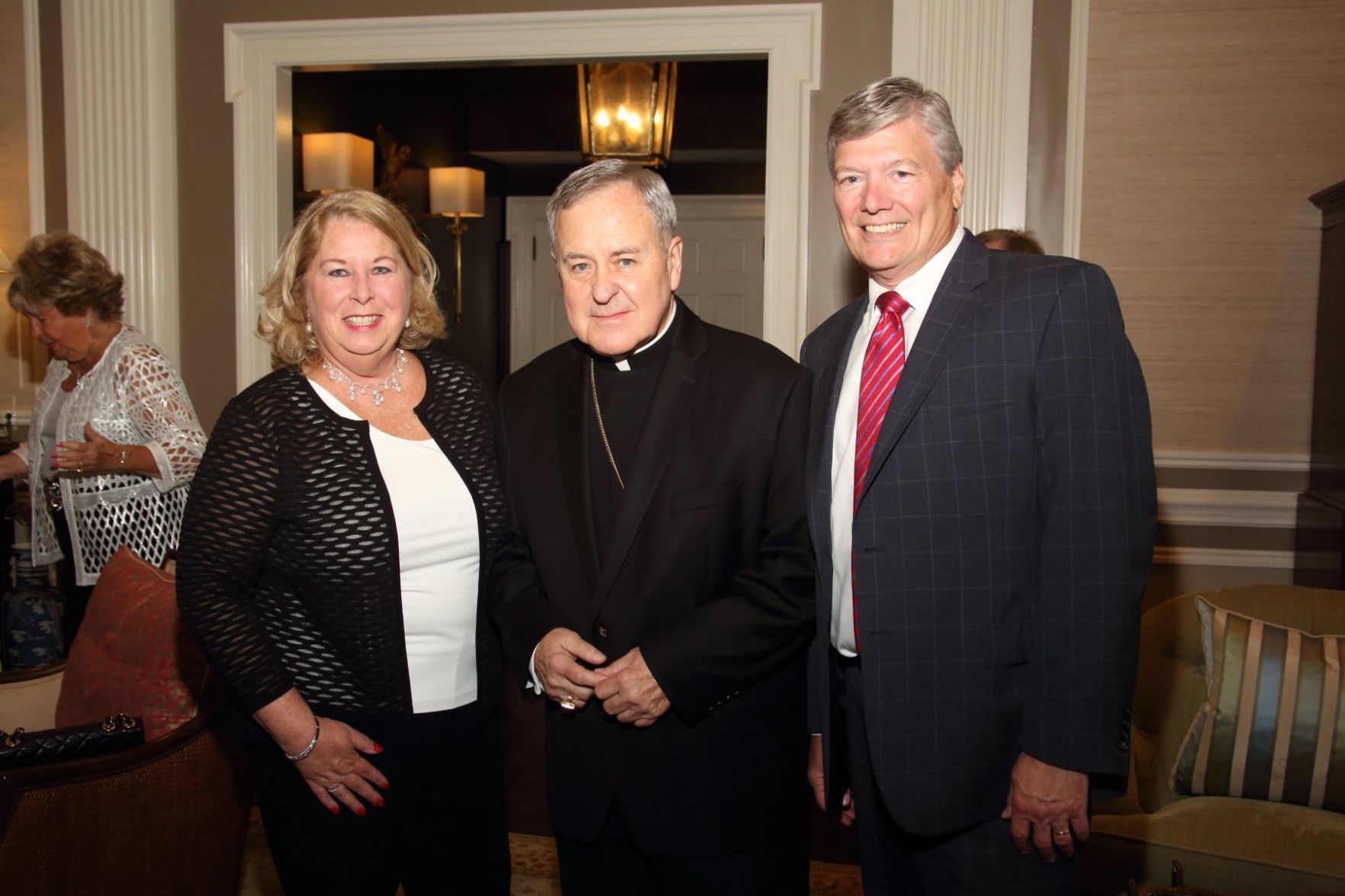 Co-Chair Pat Sauerburger, Archbishop Robert Carlson, Co-Chair Mark Sauerburger